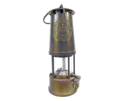 A Protectors Lamp &amp; Lighting Eccles miners lamp, Type 6 M &amp; O, with swing handle, 25cm high.