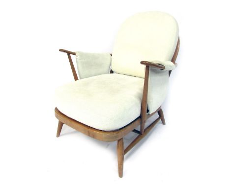 A 20thC Ercol style 203 beech framed armchair, with slatted back, and open arms, with loose back seat and arm covers.