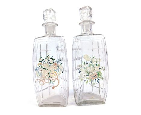 A pair of 1920s/1930s pressed glass decanters, of triangle form with two pressed panel sides and stopper, and a painted panel