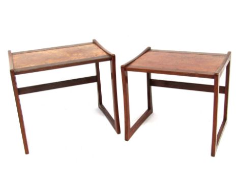 A mid century teak nest of two tables, each with a simulated burr wood inset panel, on U shaped supports, the largest 49cm hi