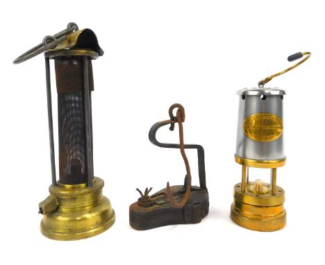Mining interest. A miniature Ashington Collier reproduction miners lamp, 17cm high, a paraffin wick burner lamp, 14cm high, a