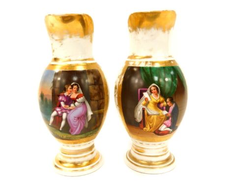 Two similar 19thC Paris porcelain water jugs, each with a fluted handle with gilt painted decoration and a central panel of t