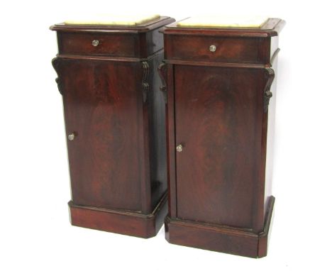 A pair of 19thC mahogany pot cupboards, each top inset with a marbled panel above a frieze drawer and single cupboard, with s