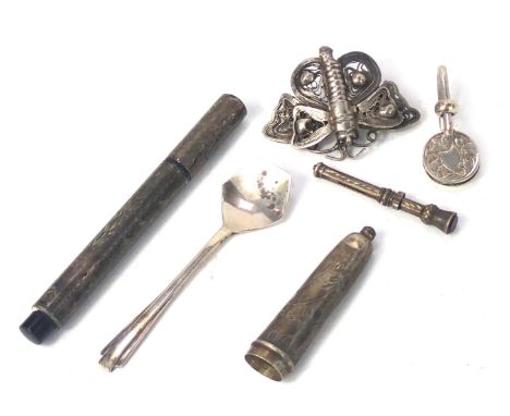 A group of silver trinkets, comprising a silver fountain pen case, cheroot holder, filigree butterfly, handbag clip, Art Deco