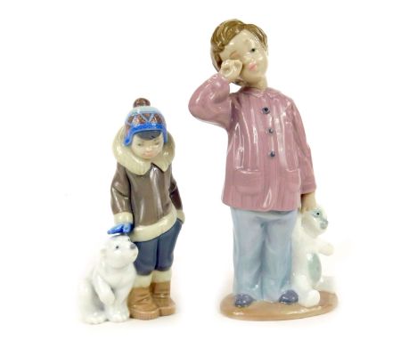 A Lladro figure of a boy in winter clothing with Polar Bear, 15cm high, and a Nao figure of a young boy carrying bear, 20cm h