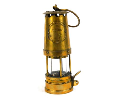 A Protector Lamp &amp; Lighting Company Eccles miners lamp, JCM1, No 117, 24cm high, with swing handle.