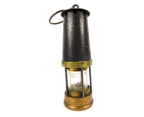 A Davis Kirkby brass miners lamp, No 84, with swing carry handle, 28cm high.