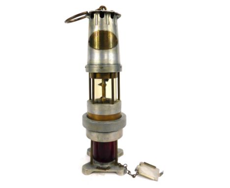 A Spiralarm Type S miners lamp, for The Detection of Combustible Gases, J H Naylor Ltd of Wigan, 35cm high.