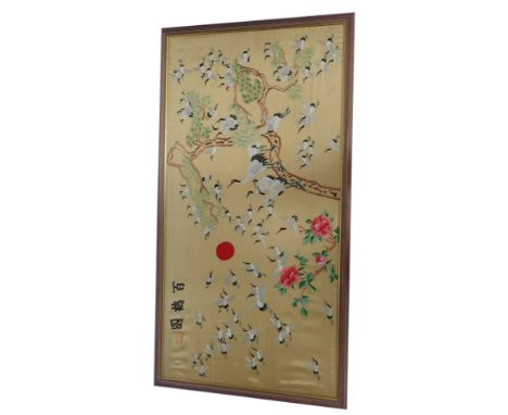 A Chinese silk embroidered panel of storks, on trees with flowers, with three character stamp signature, 60cm x 120cm, framed
