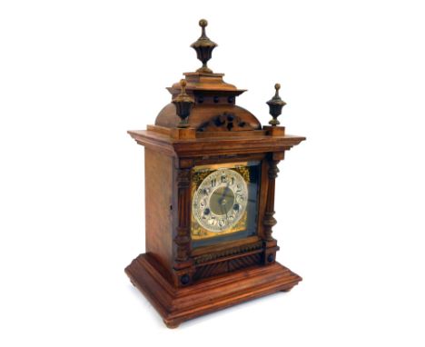 An Edwardian oak cased mantel clock, the brass Arabic numeral dial with silvered chapter ring, brass spandrels, eight day mov