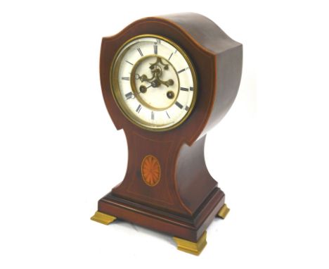 An Edwardian mahogany and inlaid mantel clock, of shaped balloon form, enamel Roman numeric dial, eight day movement, on four