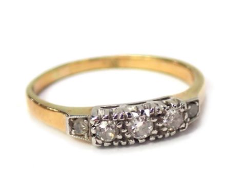 An 18ct gold diamond five stone dress ring, the five stones in platinum setting, on a yellow metal band, unmarked believed to