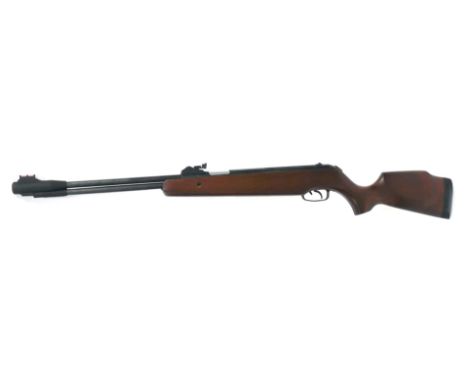 An SMK .177 calibre air rifle, XS38, with oak stock, 112cm long, with operation manual.