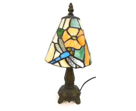 A Tiffany style small table lamp, with cream dragonfly and orange flower shade, 30cm high.