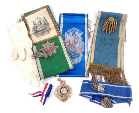 A group of Masonic regalia, comprising a Manchester Unity of Odd Fellows medallion, white gloves, blue floral sash for the In
