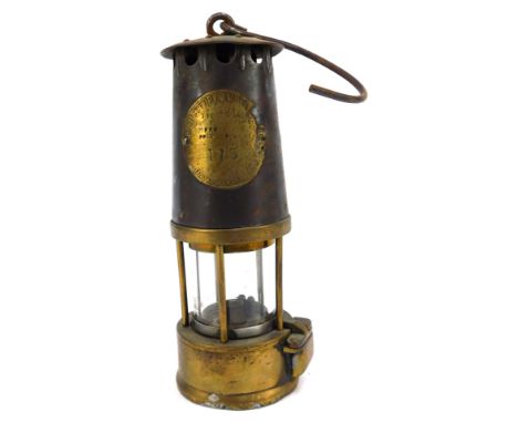 A Protection Lamp &amp; Lighting Company Eccles mining lamp, No 115, with swing handle, 24cm high.