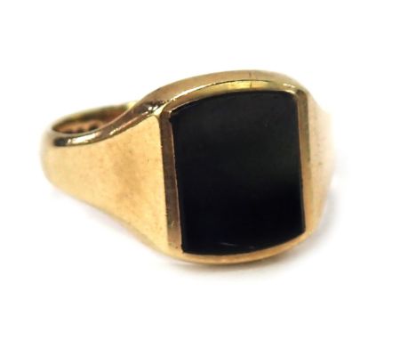 A 9ct gold signet ring, with rectangular black agate panel, on a plain band, ring size T, 5.1g all in. 