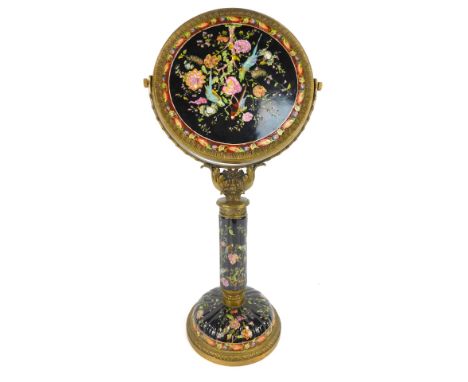 A European style oriental and porcelain dressing table mirror, the circular top with a fluted border, with a painted ceramic 