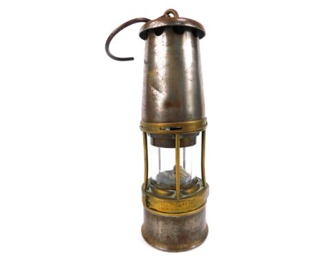 A Wolf miners lamp, by The Wolf Safety Lamp Company Sheffield, No MBS, with swing handle, 28cm high.