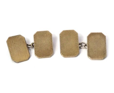 A pair of cufflinks, rectangular form with engine turned cross hatching, marked 9ct gold on sil, 7g all in. 