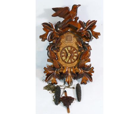 A Black Forest cuckoo clock, c1960s, mechanical movement with weights &amp; pendulum. 