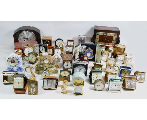 A collection of mid 20th century and later clocks, to include miniature novelty, traveling alarm clocks, carriage, clocks, ha