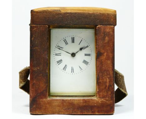 A brass carriage time piece, white enamel dial, 11.5cm, key and travel case 