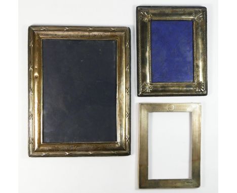 A silver photograph frame, London 1994, 25 x 19.5cm, another Sheffield 1992 and a third Sheffield 1912, all lacking easel bac