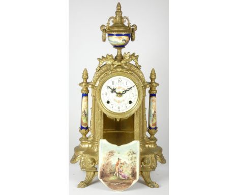 An early 20th century French gilt and porcelain inset mantel clock, having enamelled dial with Roman numerals with an 8 day m