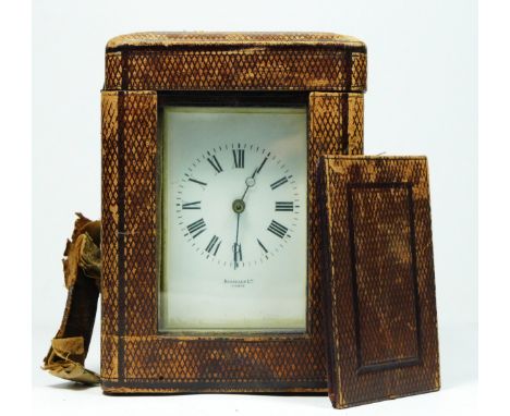 A French brass carriage time piece, white enamel dial, 13cm, key, travel case, mainspring broken, balance does not spin 