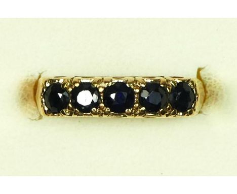 A 9ct gold five stone sapphire ring, K 1/2, 2.5gm 