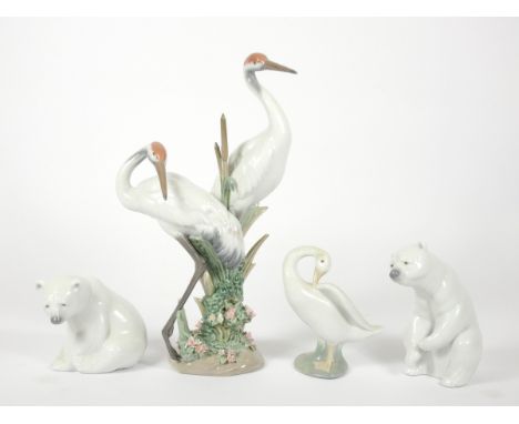 Four Llardo boxed figures, to include Courting Cranes (01611), Little Duck (04553), Polar Bear (01208) and Polar Bear (01209)