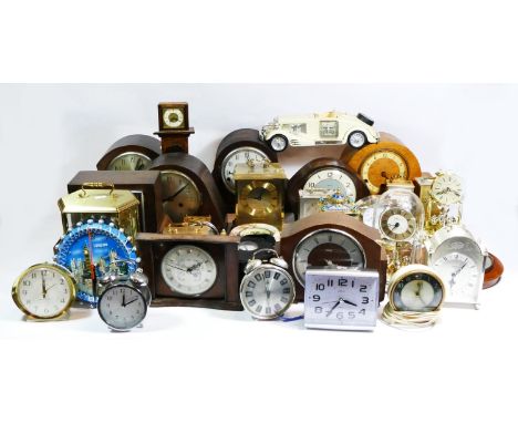 A large collection of mid 20th century and later mantle clocks and barometers, having manual &amp; quartz movements in six bo