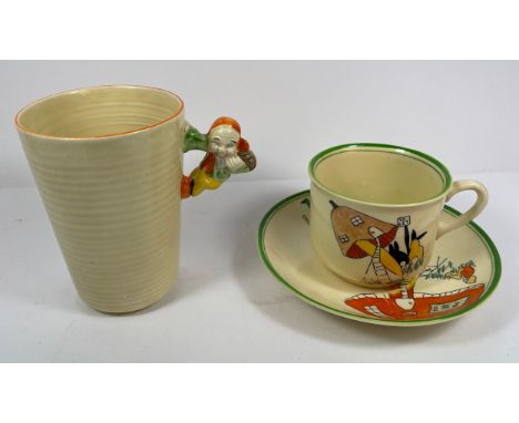 Clarice Cliff for Wilkinson Ltd, a'Pixi' handle mug, the figural handle attached to a plain tapering body, back stamp to the 