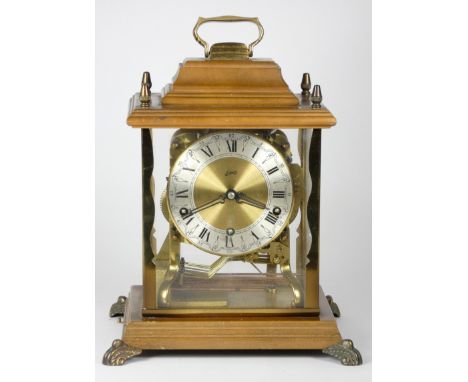 A Schatz German mantel clock, c1950s, having steeped base with removable upper section, brass framed with acrylic panels, wit