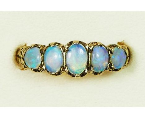 A 9ct gold opal five stone diamond ring, carved claw set with graduated stones, Q, 3gm 