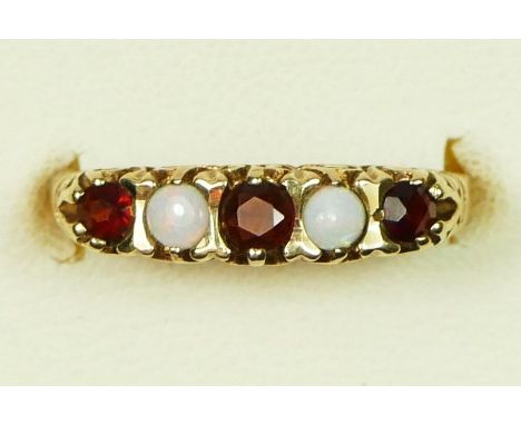 A 9ct gold opal and garnet five stone ring, O 1/2, 1.9gm 