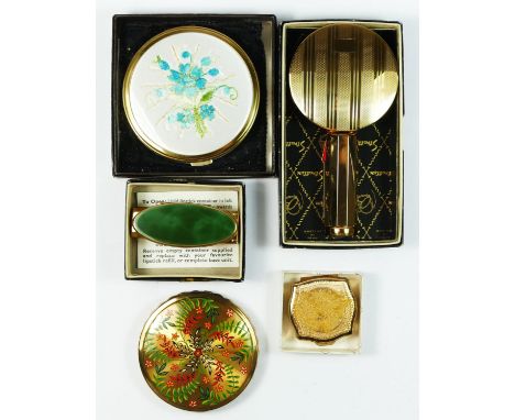 A Stratton No. 2 combined mirror and lipstick, apparently unused, box, an oval version, box, a Mimosa powder compact, a flora