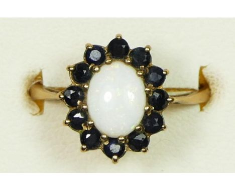 A 9ct gold opal and sapphire cluster ring, P, 1.9gm 