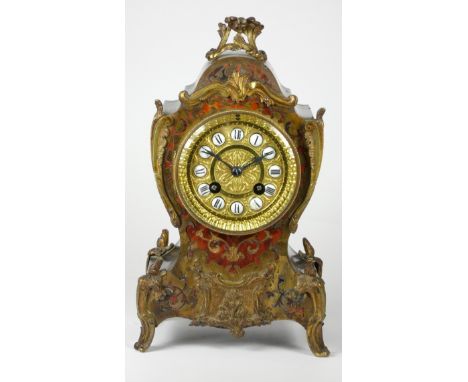 A 19th century French Boule striking bracket clock, having gilt dial with porcelain roman numerals, the ebonised case inlaid 