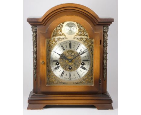 A mid 20th century bracket clock, filigree dial with appliques  Tempus Fugit, silvered dial with roman numerals, 8 day moveme