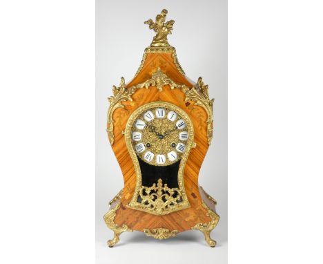 A late 19th century Louis XVI style Boule mantel clock, inlaid walnut case with applied embossed gilt decoration, the gilt di