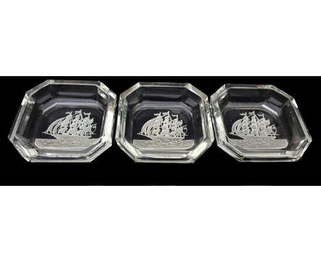 Three Baccarat type pin dishes with reserve acid cut intaglio decoration of a three masted ship, canted square form, 7.3cm di