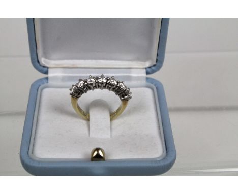 A fine quality seven stone brilliant cut diamond half hoop ring mounted in 18 carat white and yellow goldH - I in colour appr