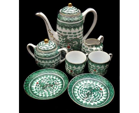 A Chinese fammile verte porcelain coffee tete a tete service, painted with dragons and cloud motifs, comprises coffee pot and