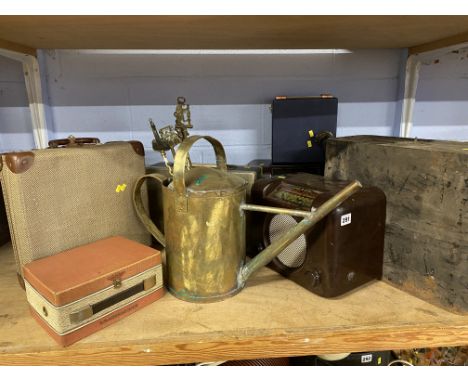 Shelf of brassware, two Bush radios etc