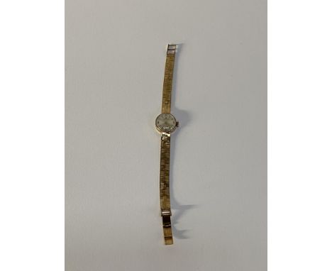 A  9ct textured gold ladies cocktail watch, the silvered Hamilton marked dial with baton markers and enclosed within a 9ct go