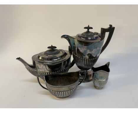 An early 20th century silver plated four piece tea/coffee service, with engraved presentation inscription
