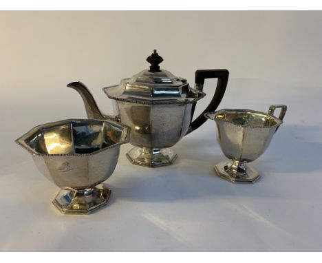 An early 20th century silver three piece tea service, hallmarked Joseph Rodgers and Sons, Sheffield, dated 1910, gross weight