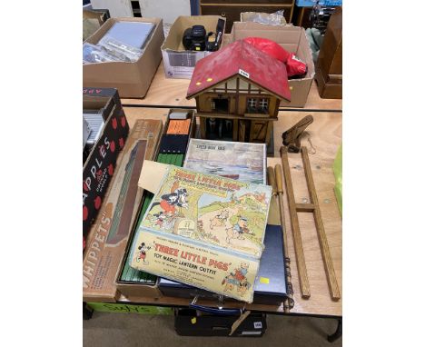 Various boxed vintage toys including a Racing Whippets game and a miniature doll's house with contents